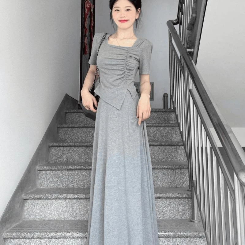 套装女夏季新款简约开叉不规则短袖上衣高腰中长款半身裙子两件套