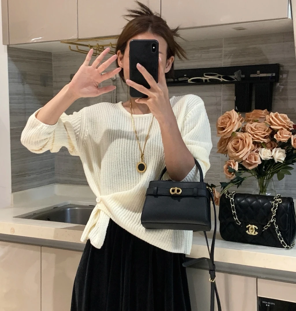 韩系设计感下摆提扣针织衫女秋冬新款百搭简约休闲纯色毛衣