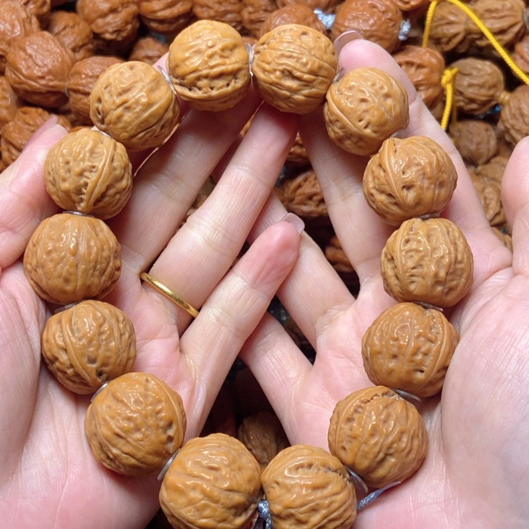 桃核吊坠光头足球手串