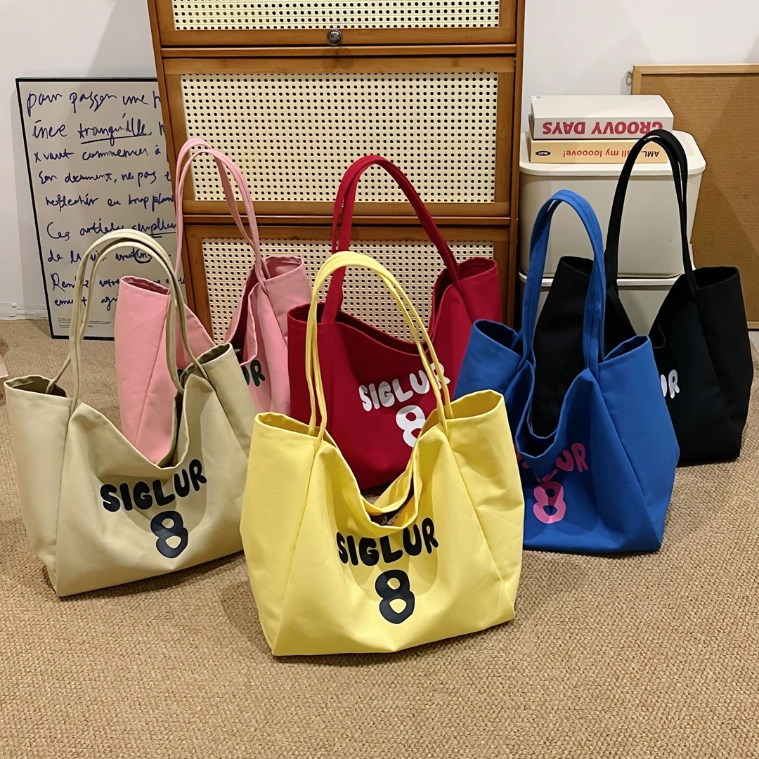 时尚百搭帆布包休闲夏季单肩包小清新小众大学生纯色印花ins