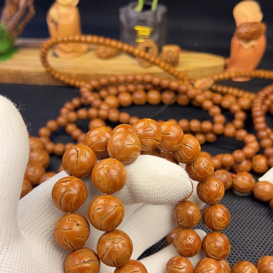 张***森野生龙纹桃核光珠