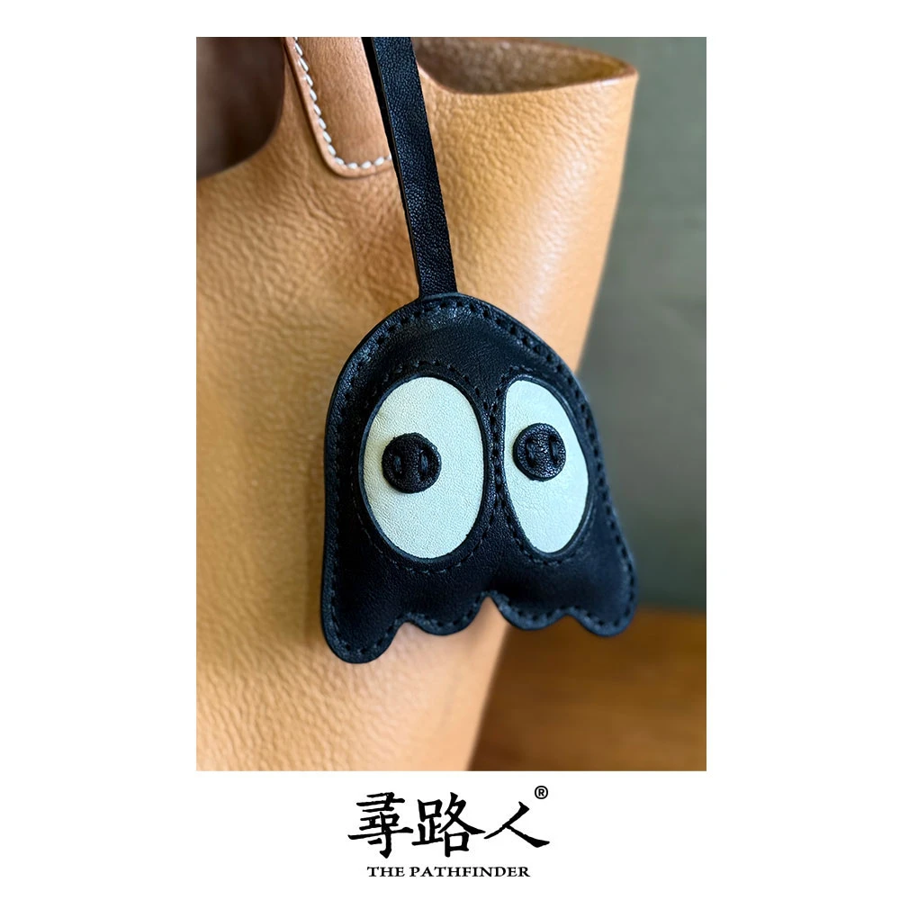 寻路人可爱真皮手工质感可爱男士斜跨包黑眼豆豆