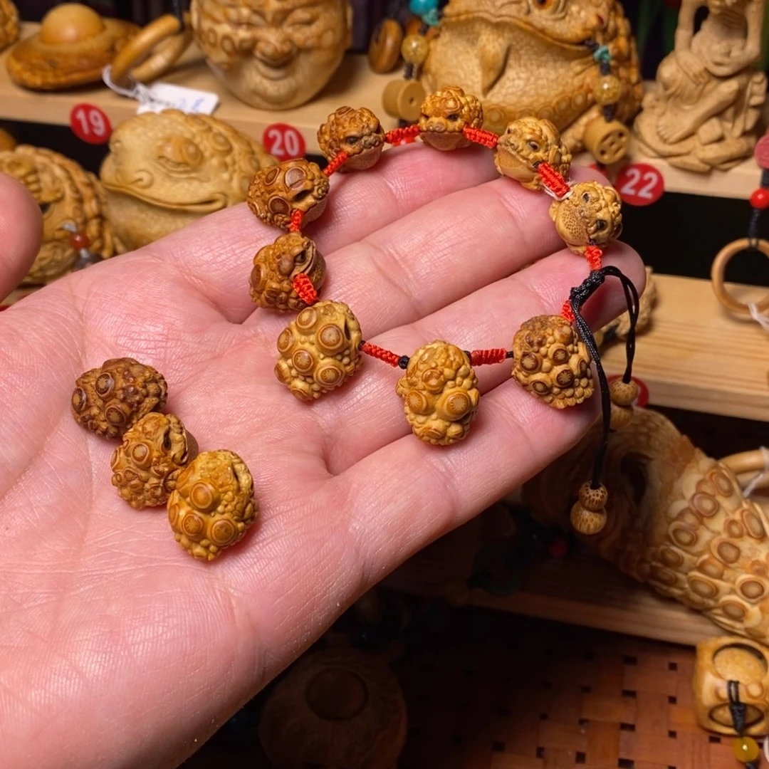 竹蜀****关根雕12颗金蟾手串