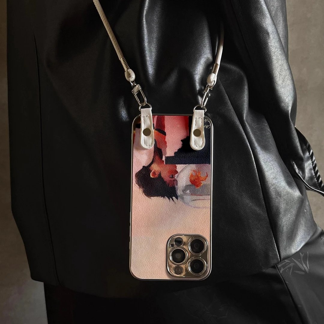 适用于苹果16手机壳15新款14外壳13小羊皮12防摔斜跨挂绳金鱼少年