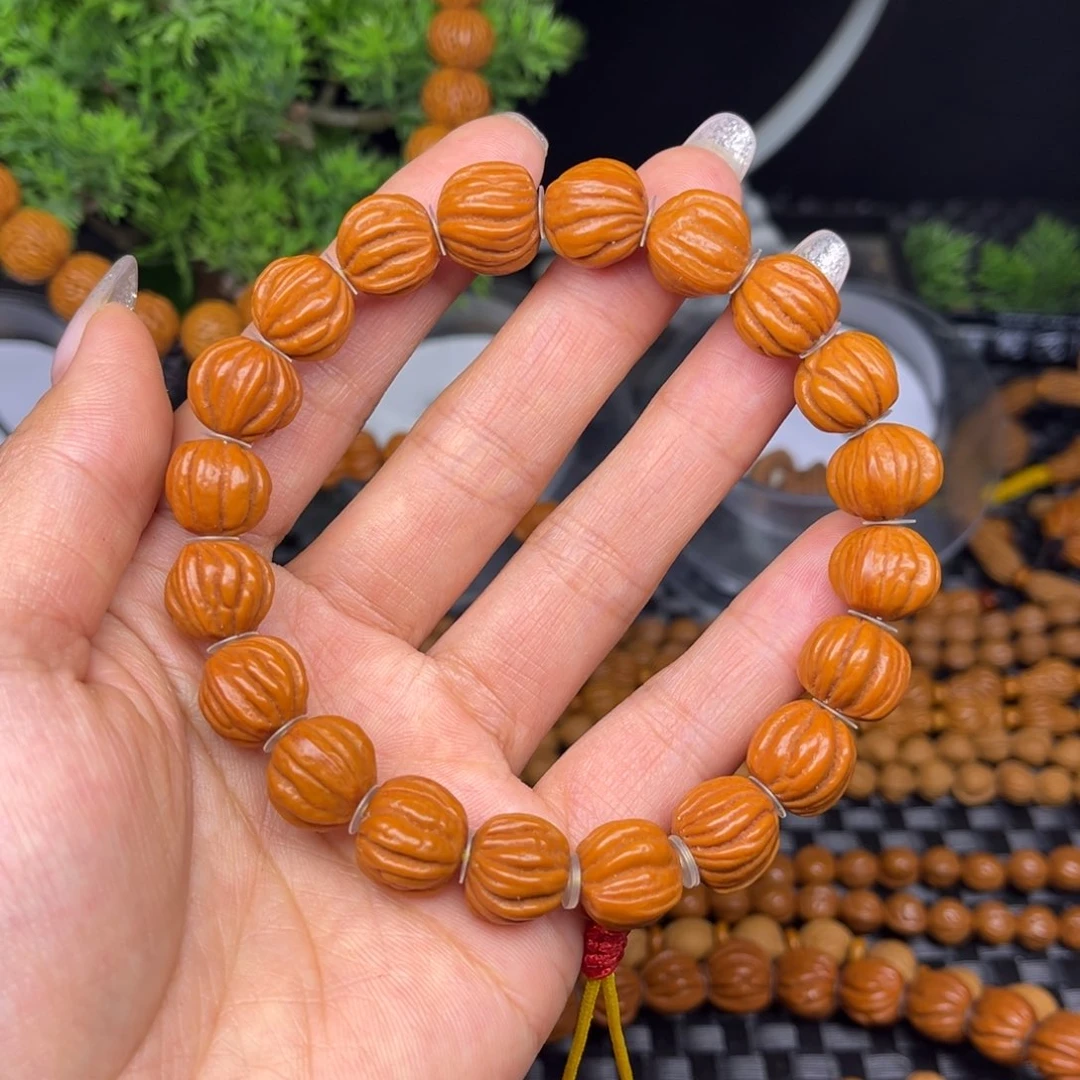 杰***。文玩核桃吊坠佛手手持