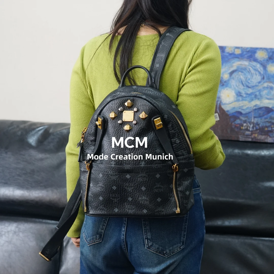 95新 MCM  黑金双肩包/F3BB10427009/7009