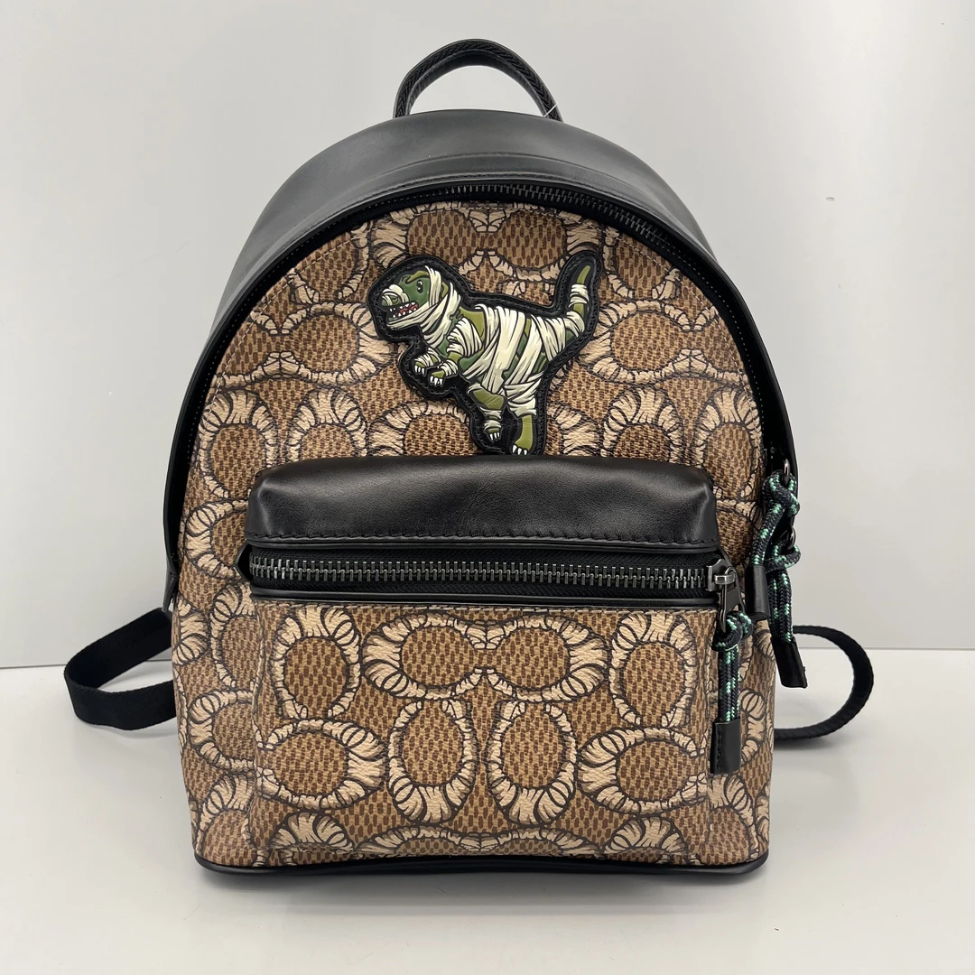 95新 COACH/蔻驰 恐龙黑拼老花双肩包24*32*10cmE042508