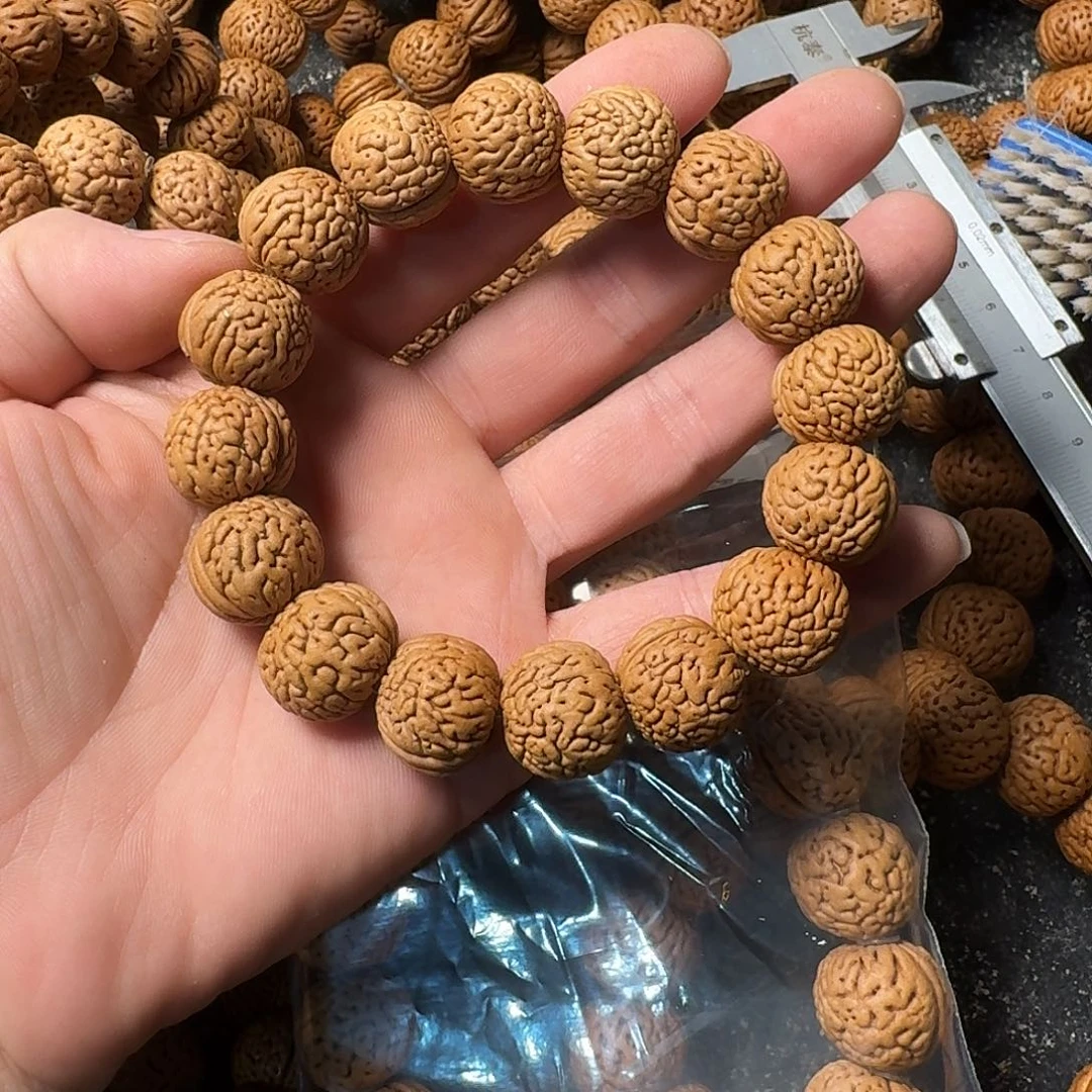 桃核吊坠盘锦肌肉手串