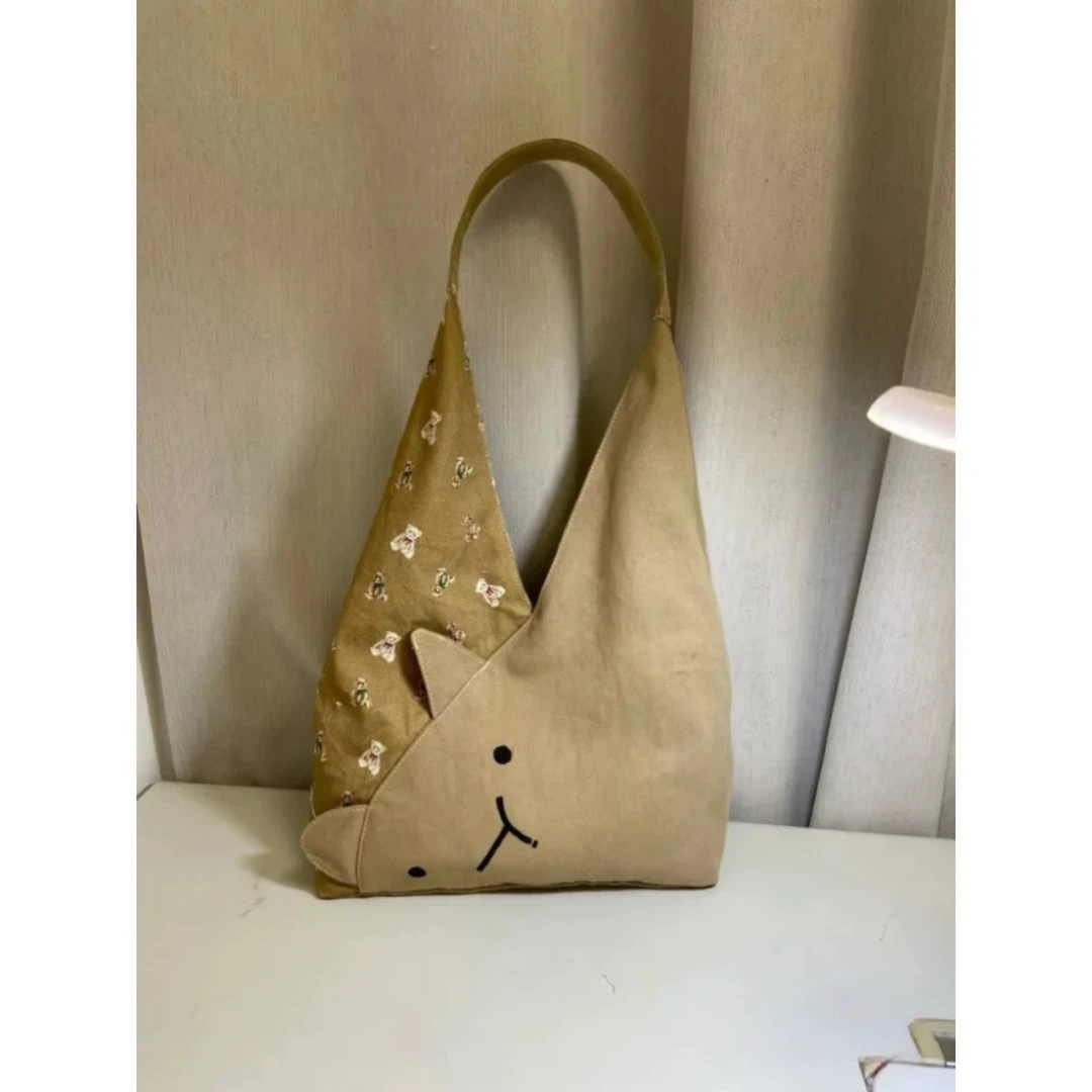 可爱猫咪水桶包2025日式新款卡通帆布包休闲百搭大容量通勤单肩包