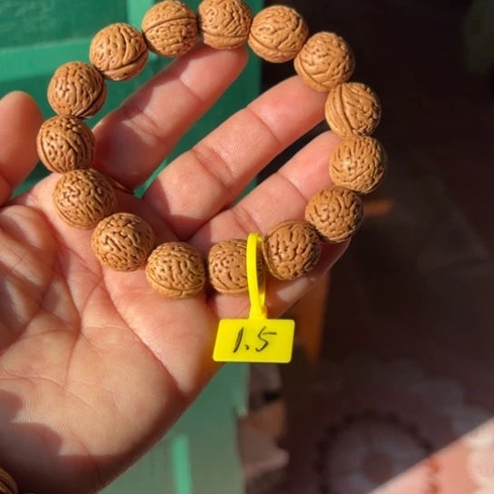 醒***悟木质野生桃核手串