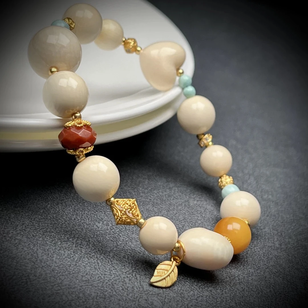 H1117天然猛犸牙 爱心手串12.8克支持鉴定假一罚十