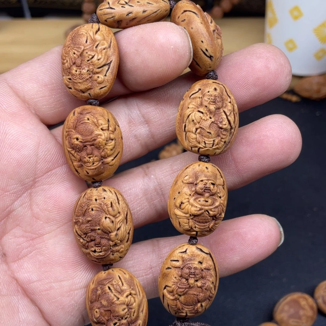 桃核雕刻财神手串