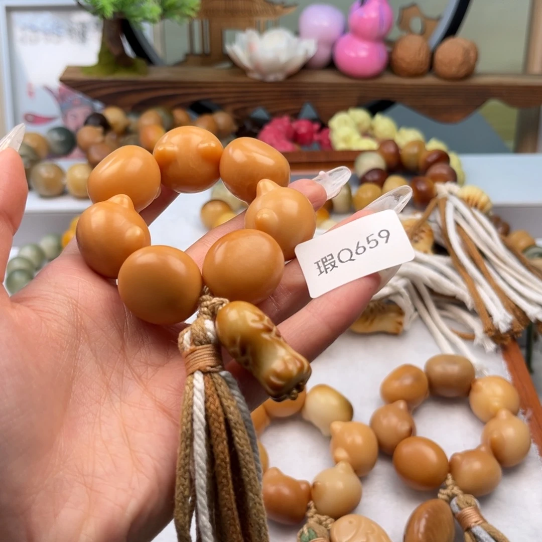 菩提根/象牙果手串A****?21mm瑕猫头手捻一串q659