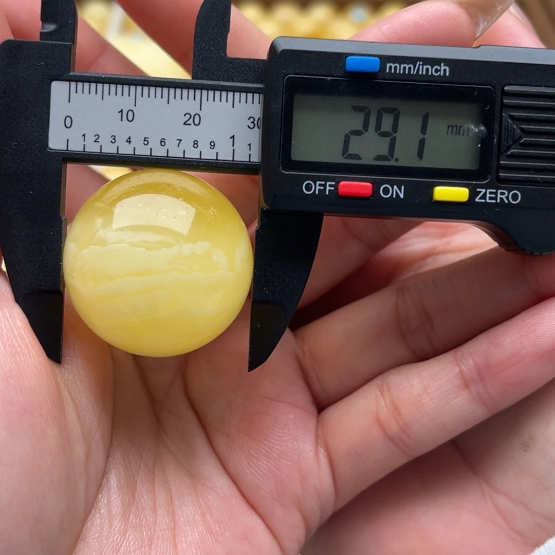 袁***满琥珀未镶嵌裸石蜜蜡圆珠微瑕笑