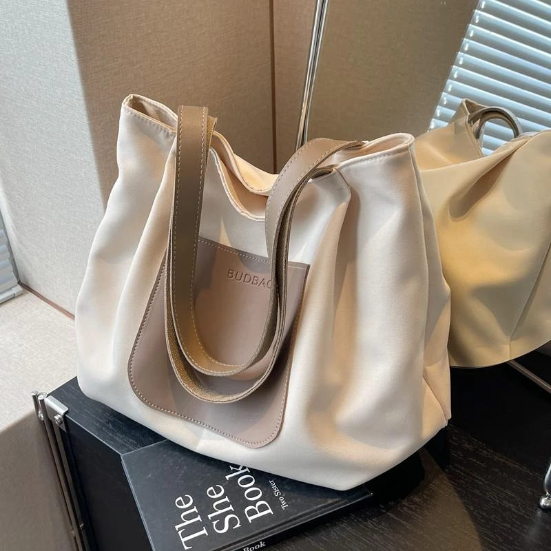 休闲大容量包包女2025新款简约百搭通勤单肩帆布托特包轻便旅行包