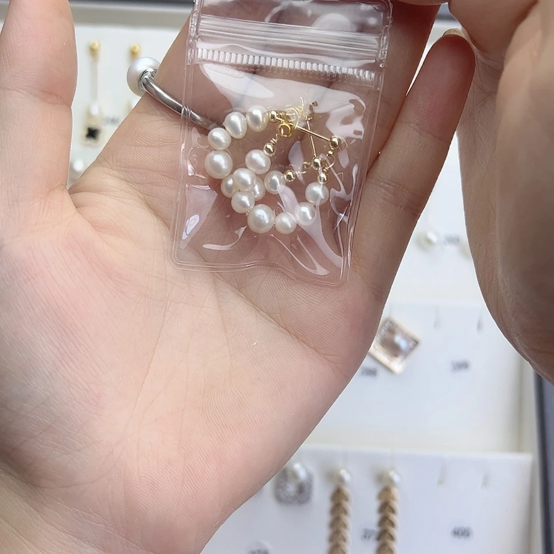 哈***咚银S925镶嵌淡水珍珠耳饰