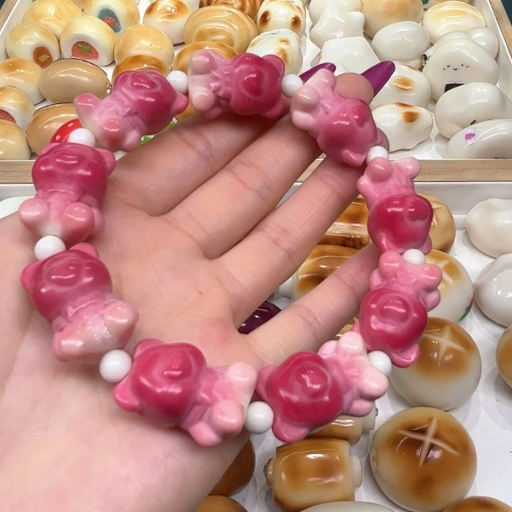 白玉菩提把件2.25.50象牙果粉色渐变小熊