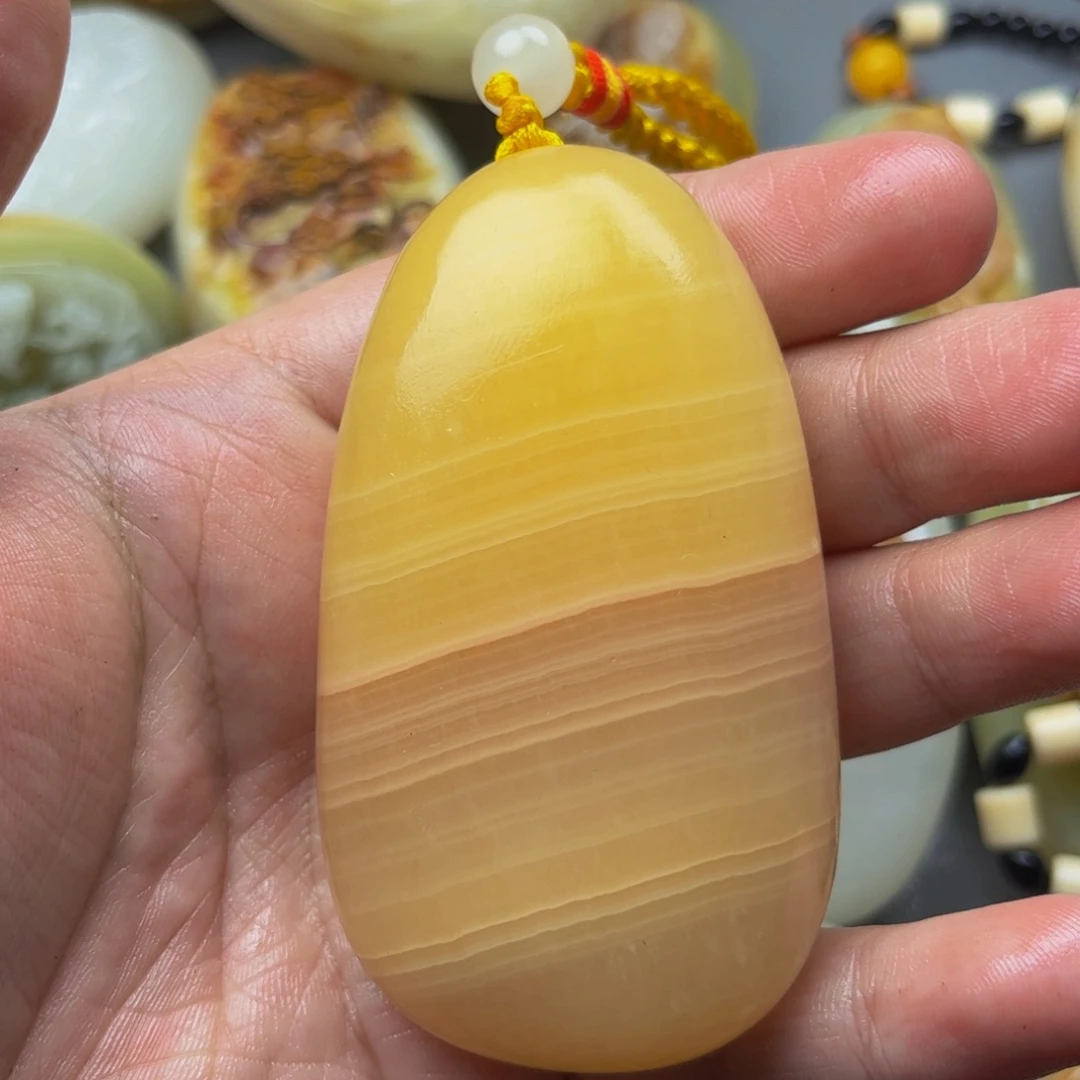 墨***石材方解石手把件