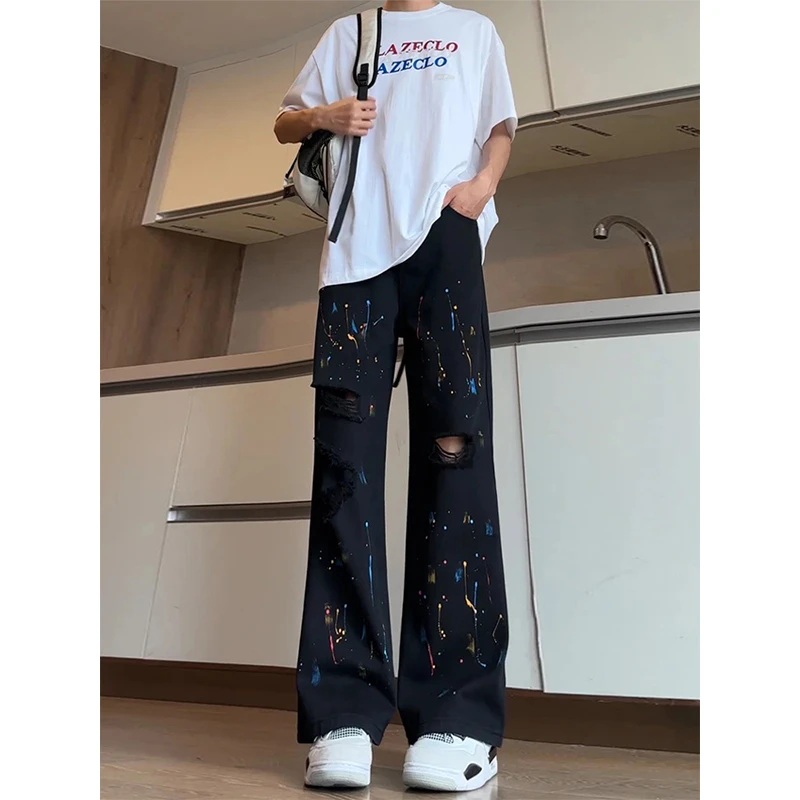 黑色泼墨破洞牛仔裤男款夏季潮牌痞帅炸街裤子美式高街直筒微喇裤