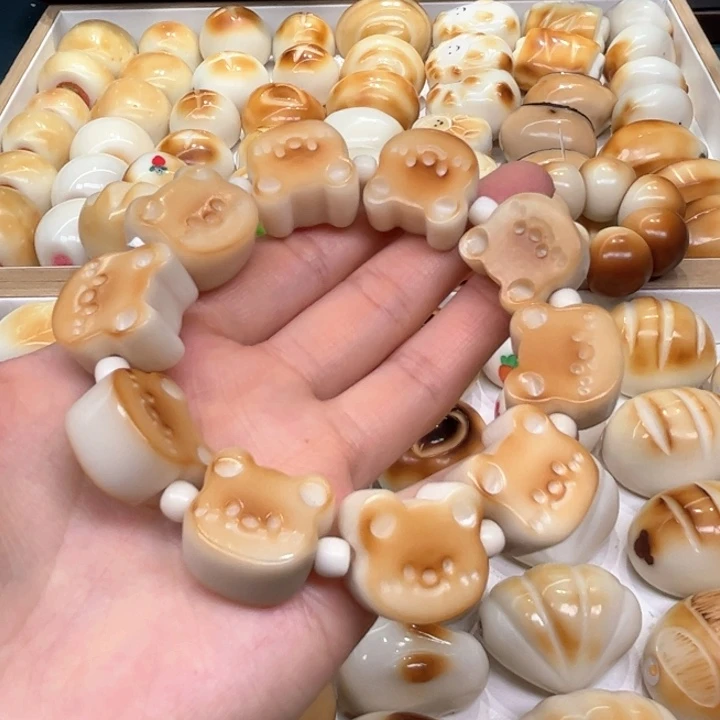 白玉菩提把件3.6.53象牙果炭烤小熊饼干微瑕