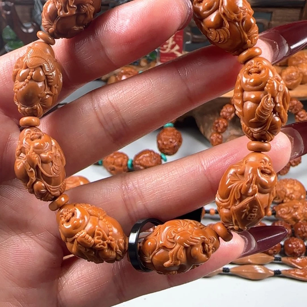 橄榄核手串/手链宽1.4小籽鸡血红水晶核八宝弥勒佛手串