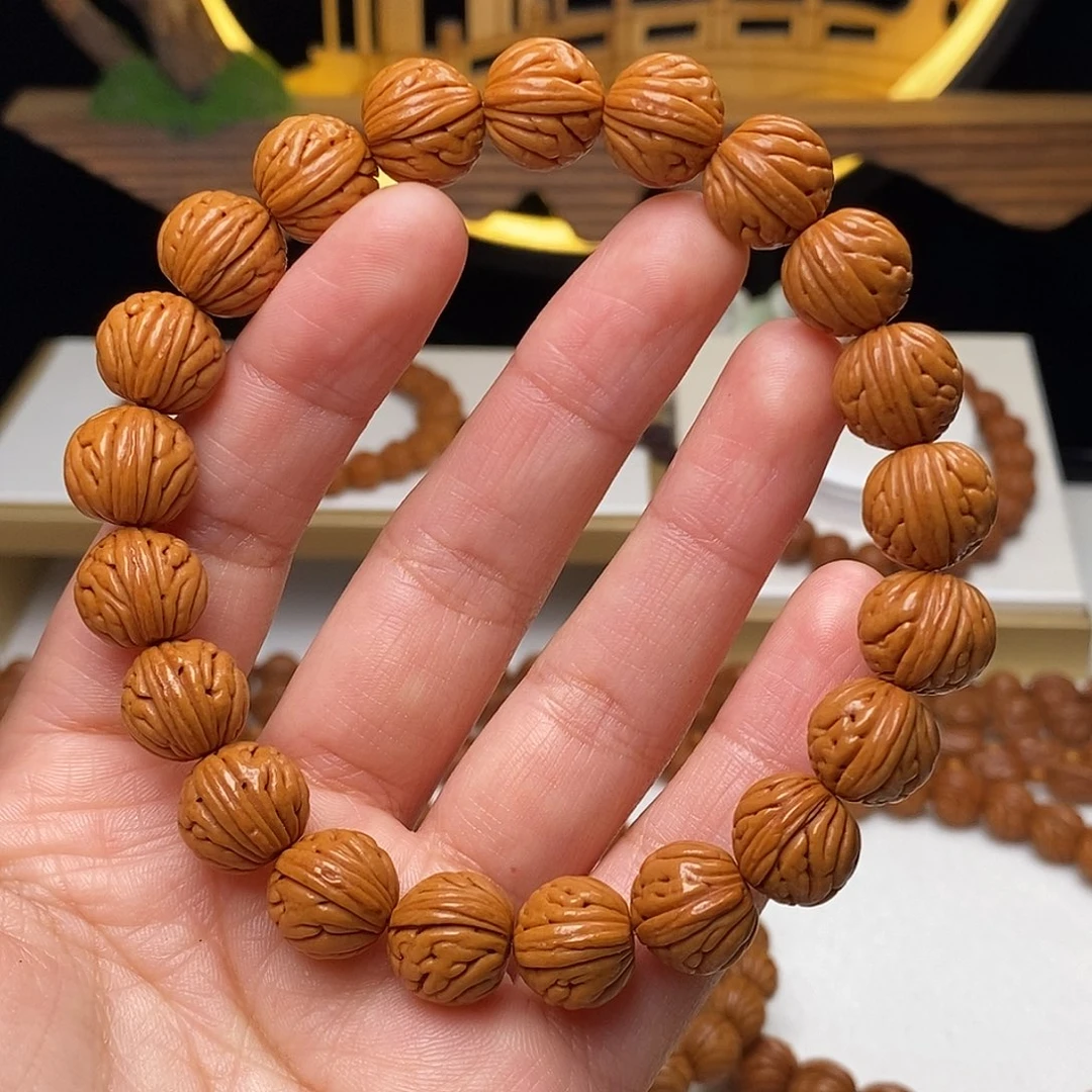 仙***道桃核手串12mm野生金麒麟桃核手串