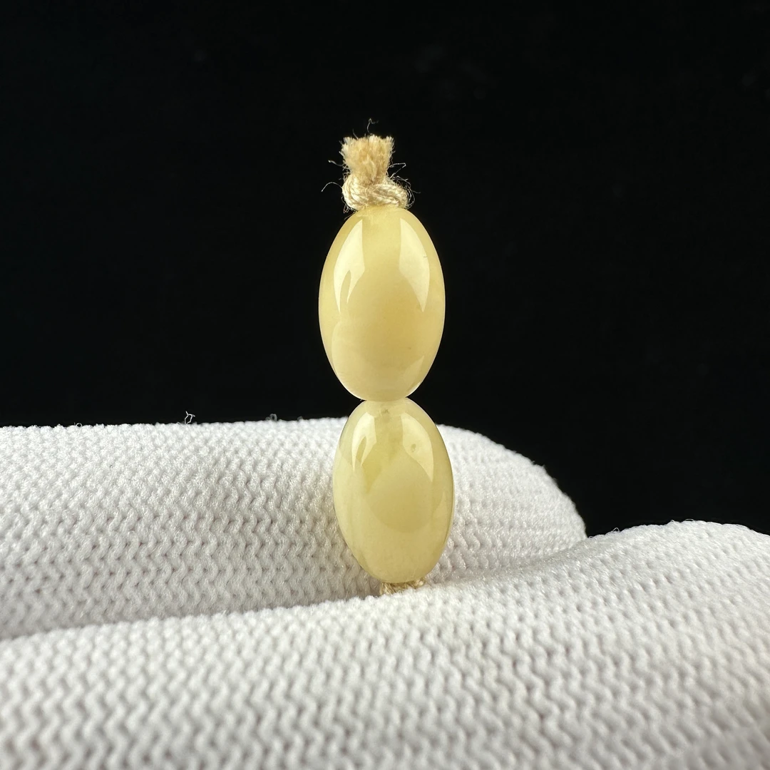 K2574天然原矿蜜蜡 对珠7mm支持复检假一罚十