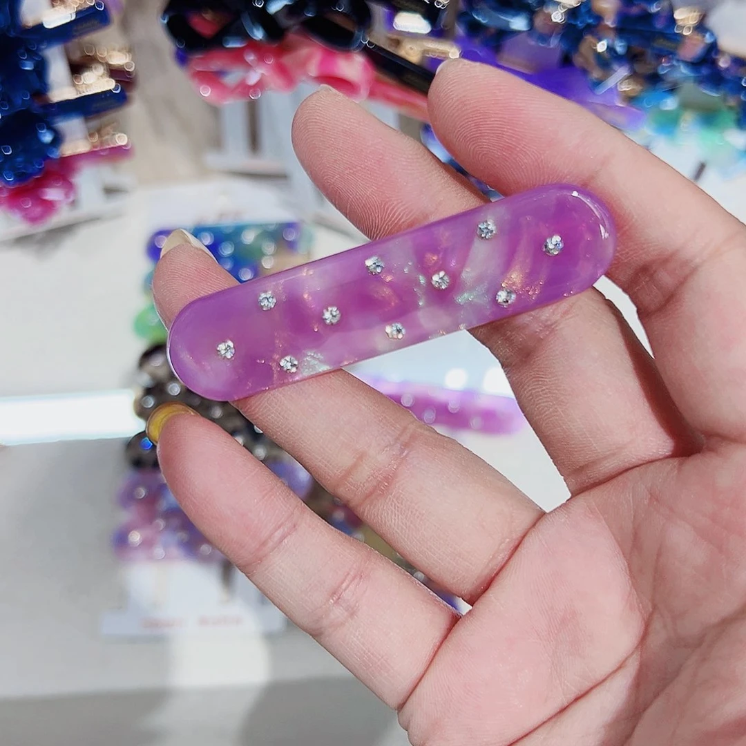 布艺非金属醋酸边夹一个紫闪钻