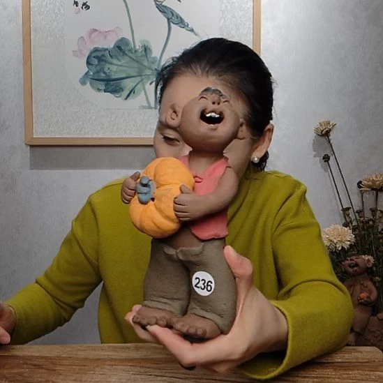 卡***咪粗砂不规则羲媧娃系列作品抱瓜男娃