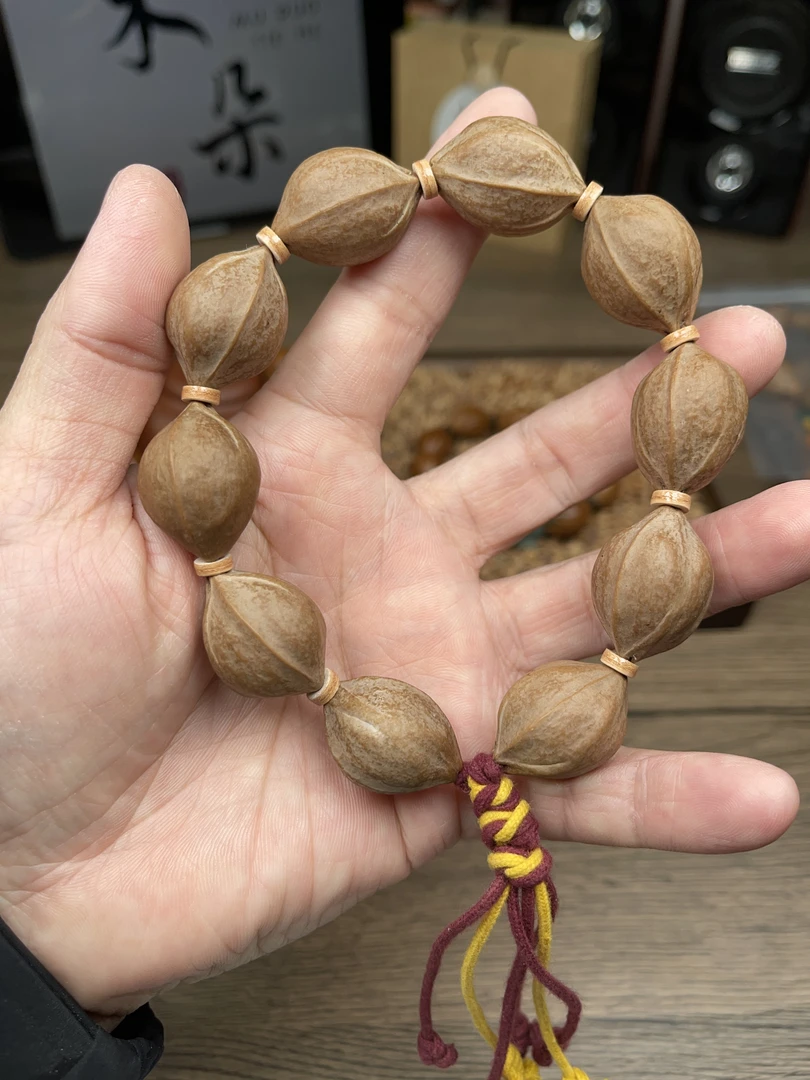 1.9*2.6 尺寸广东梅林铁核橄榄核手串素串抛光去霜打底精品文玩