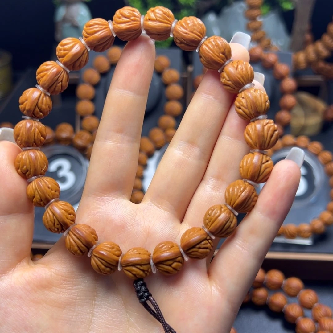 桃核手串M****?火麒麟12手持