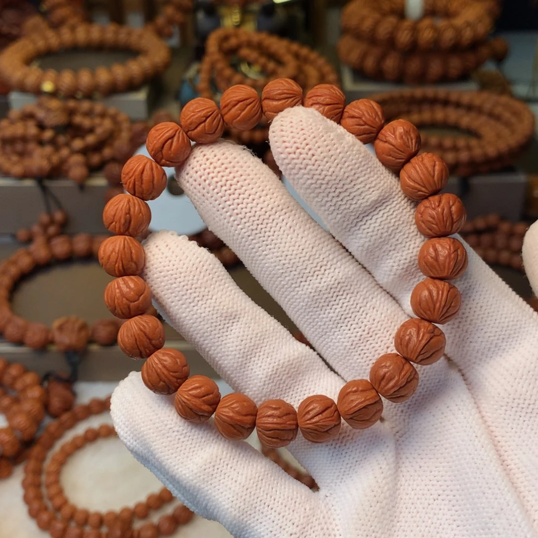 凡***人手串桃核秦岭龙纹