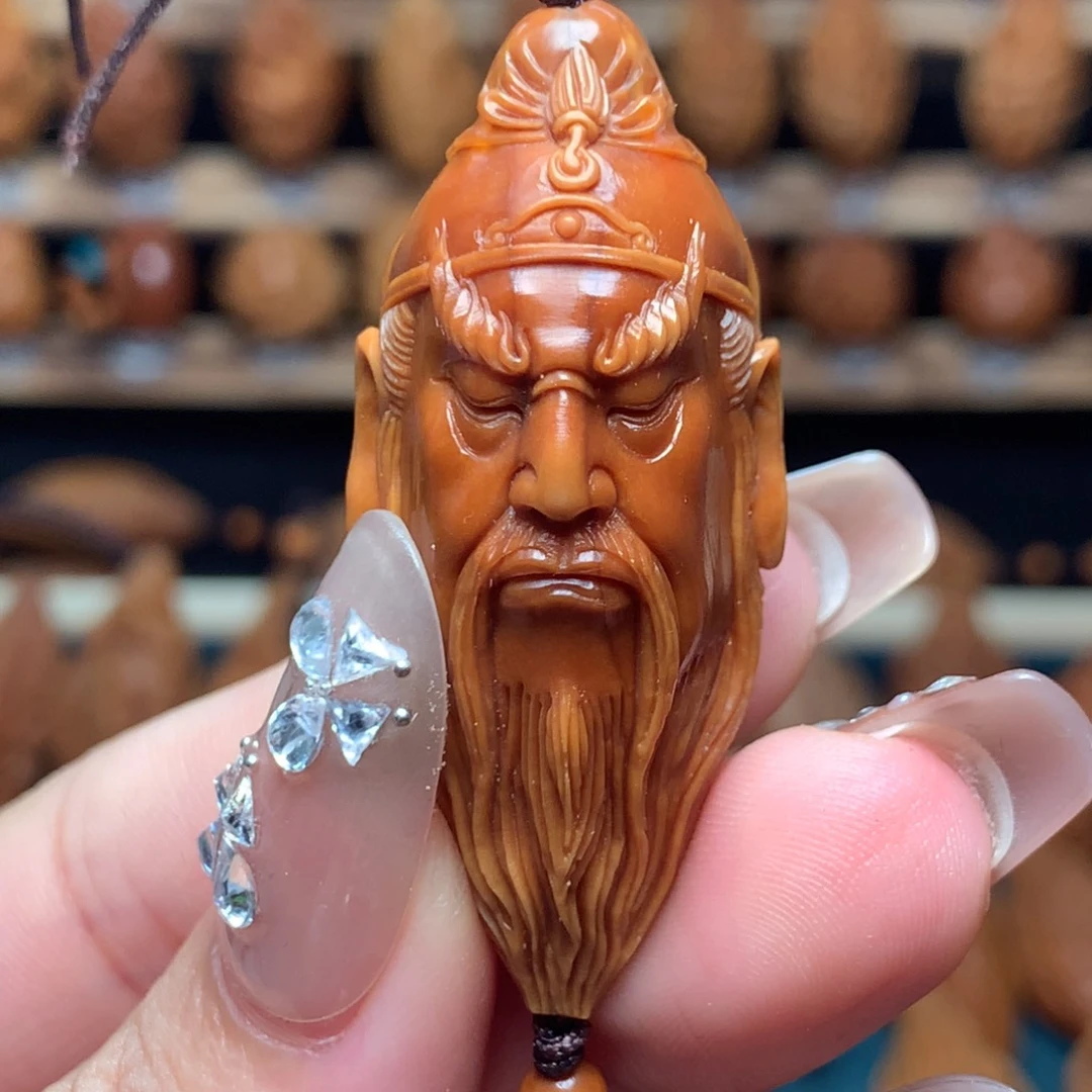 橄榄核把件关公头