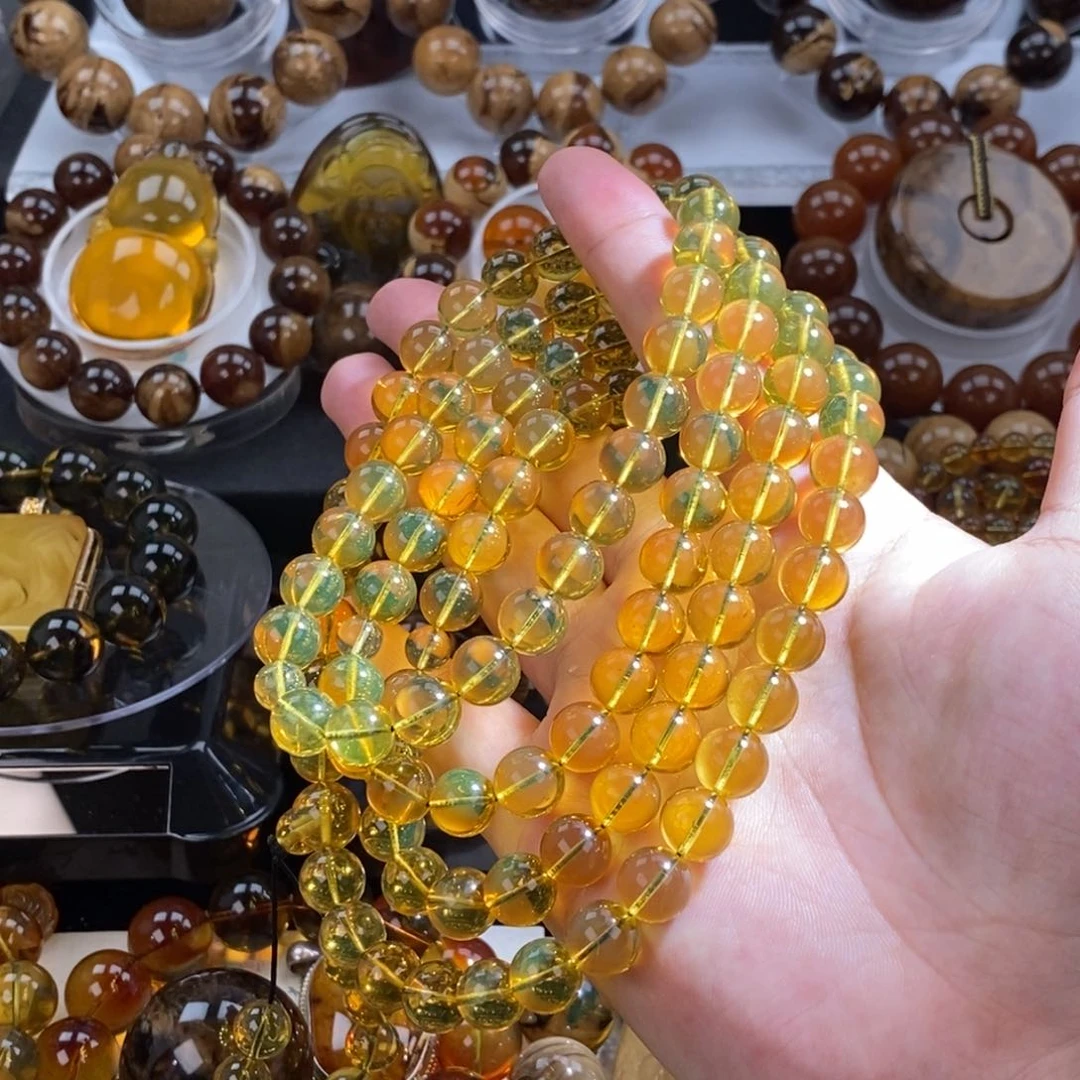 樱***梦未镶嵌琥珀珠宝奇石60.6克，9大加规格