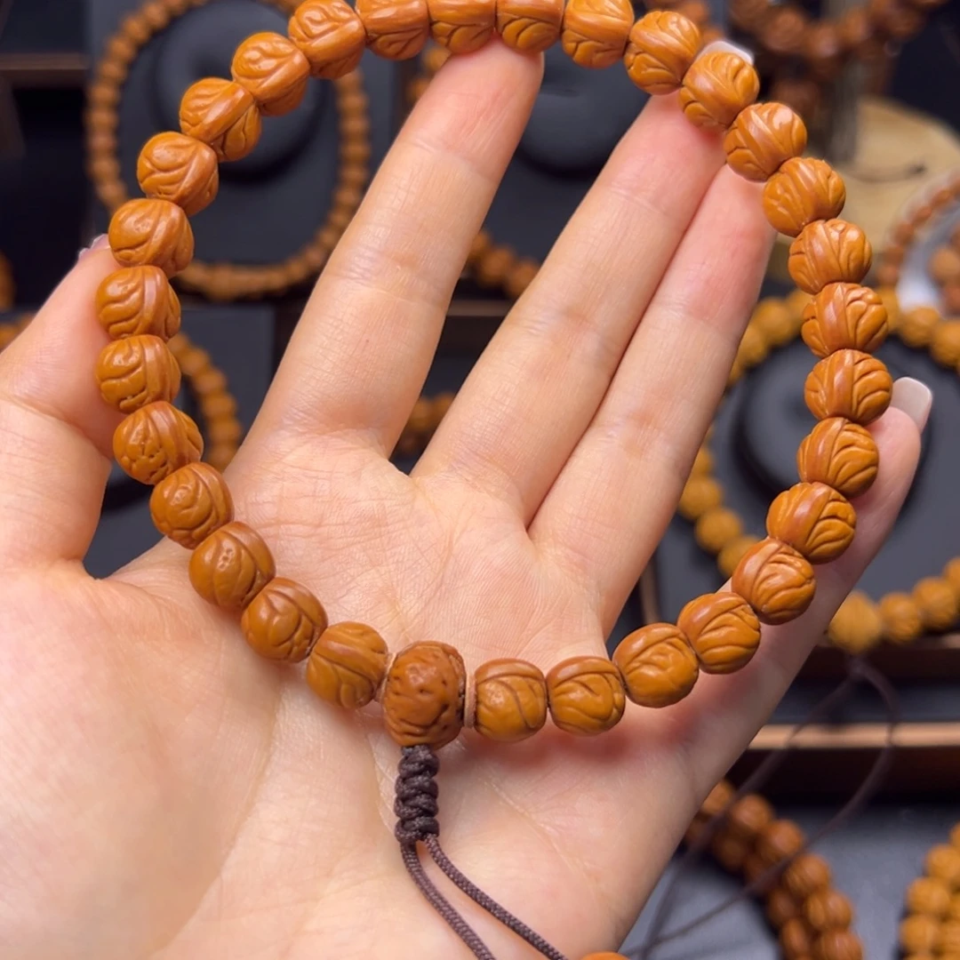 乐****手串桃核野生玉龙脊10