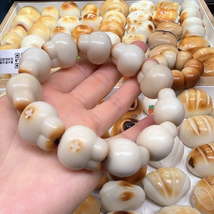 白玉菩提把件3.6.54象牙果炭烤兔头微瑕