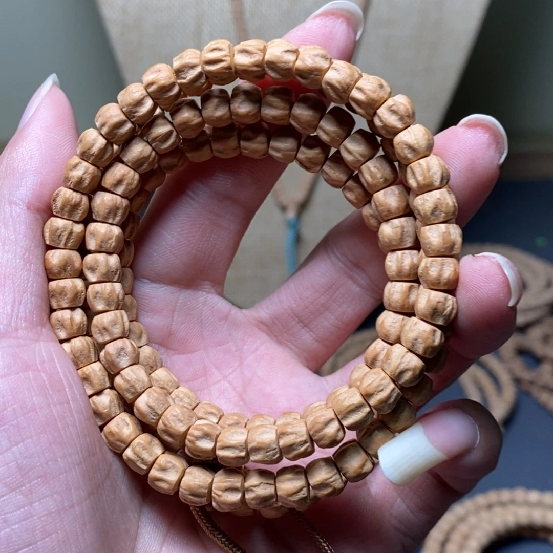 柏香籽/百香籽吊坠6.8粉皮直切鬼脸