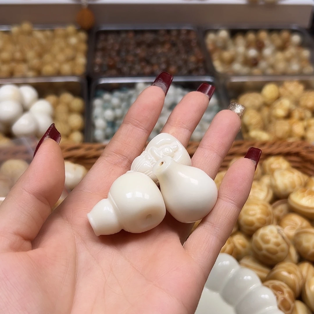 暖***暖手串菩提根/象牙果瑕疵三通3颗有裂