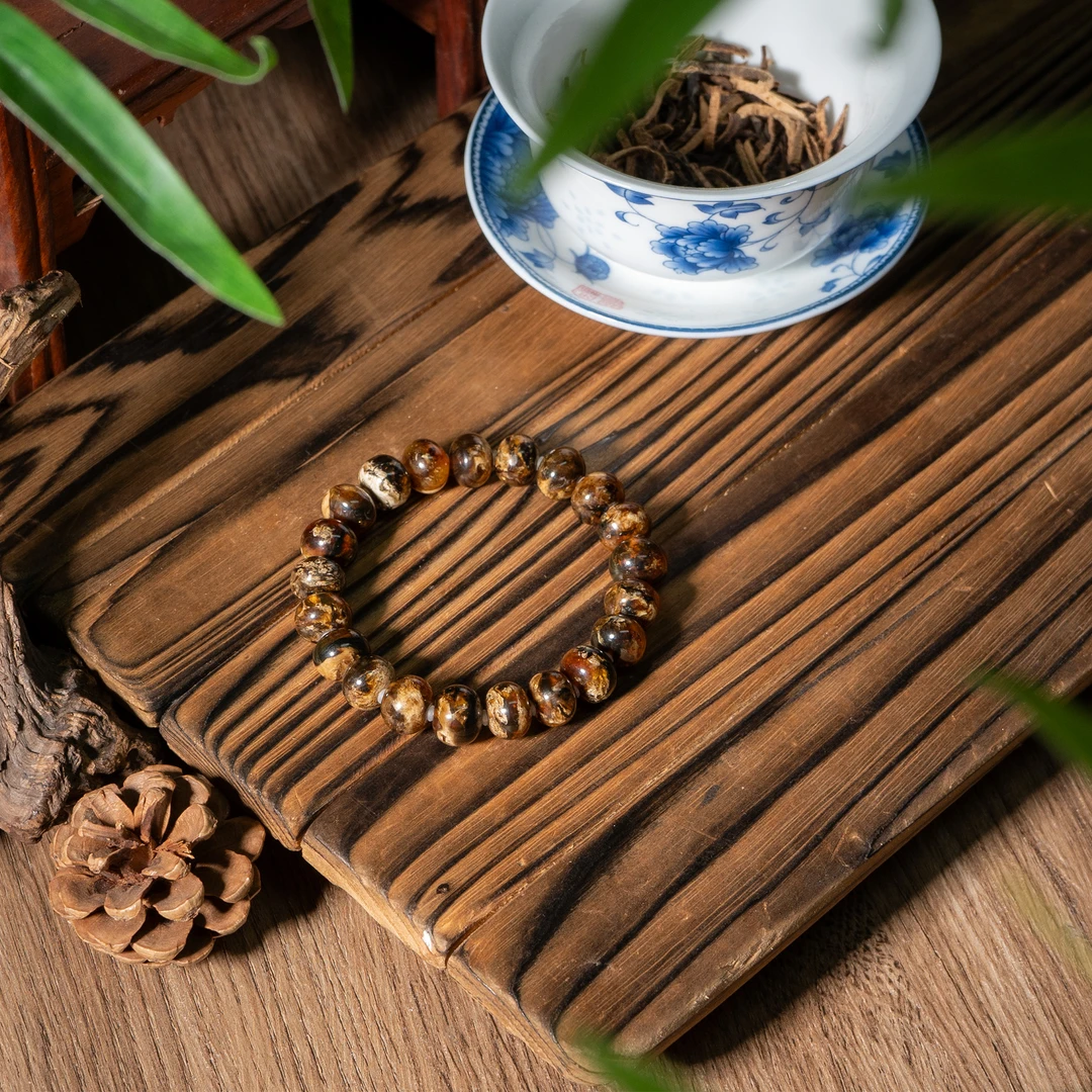 -抚顺琥珀蜜蜡特级干白花手串/多样性发/P4784