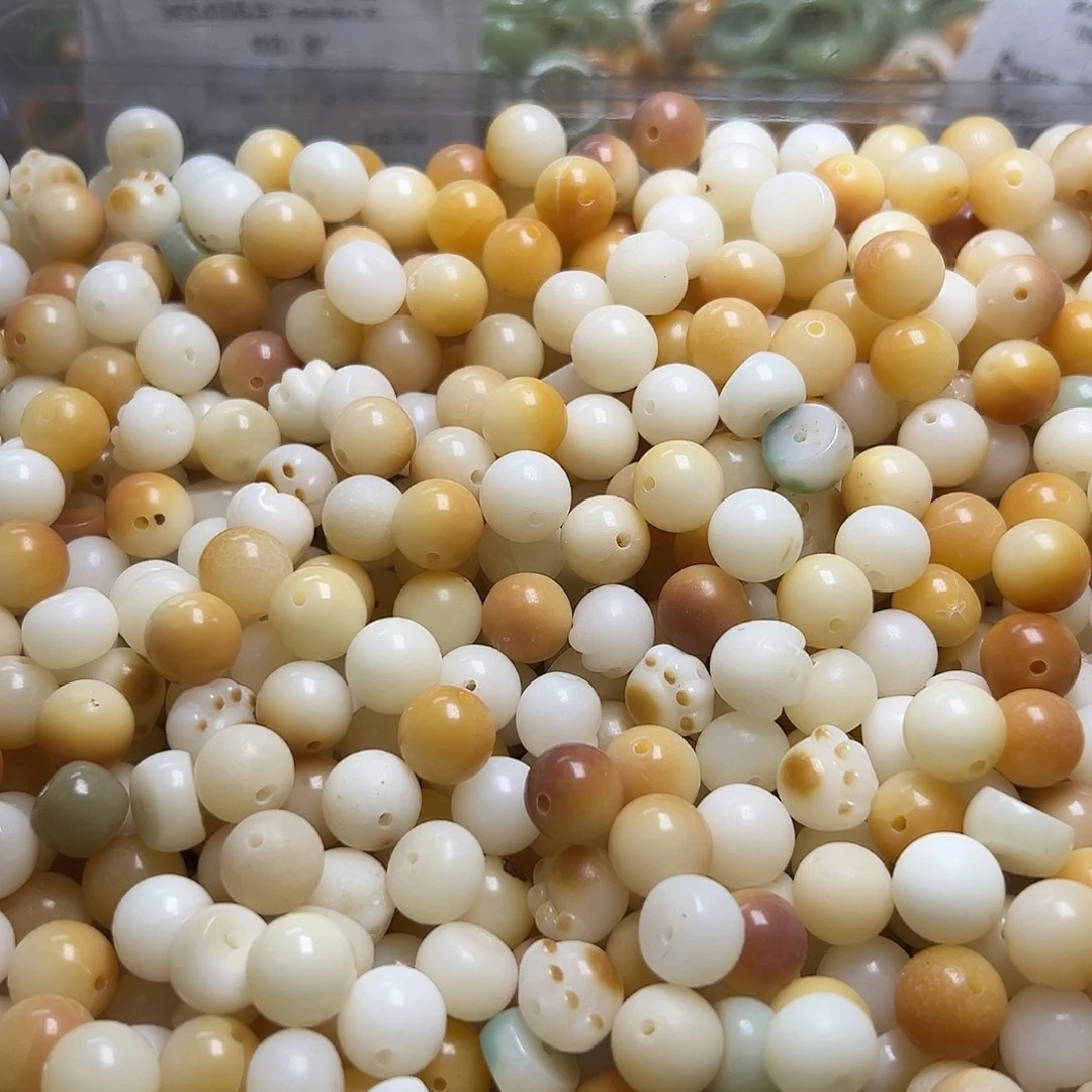 白玉菩提吊坠瑕疵炭烤混300颗