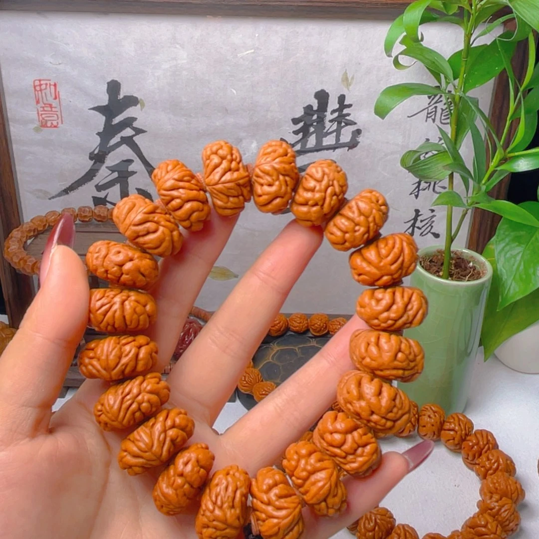 唐***人秦岭龙纹桃核手串