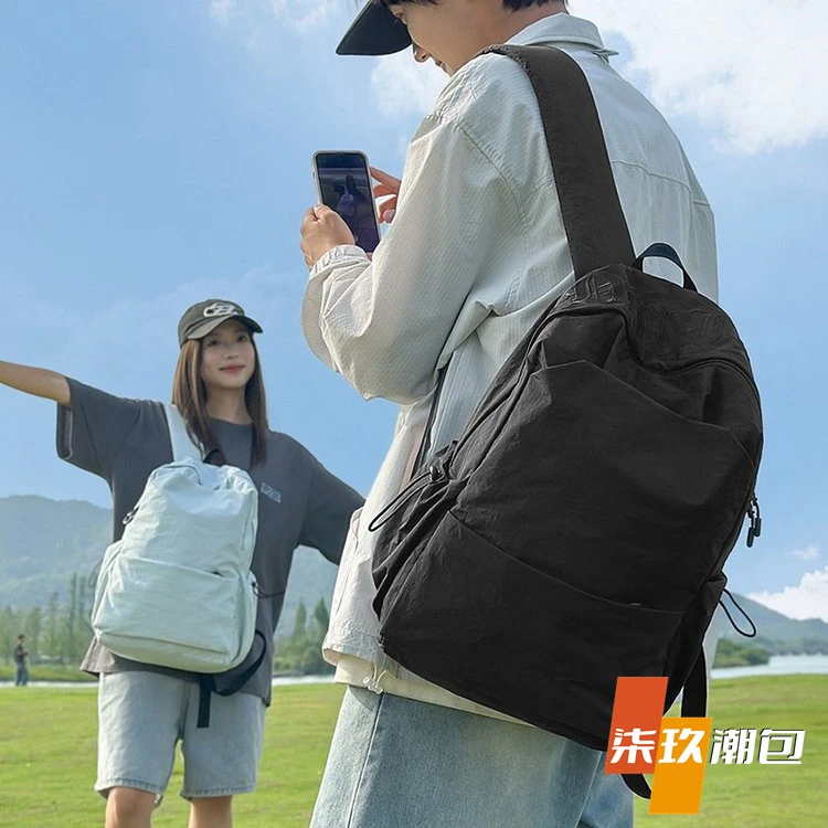 柒玖2025新款大容量电脑包男女大学生书包纯色简约字母印花背包