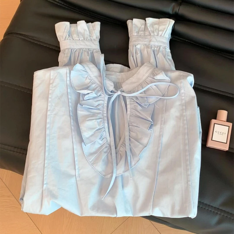 韩版设计感蓝色木耳边娃娃衫女早春2025时尚新款系带长袖衬衫上衣