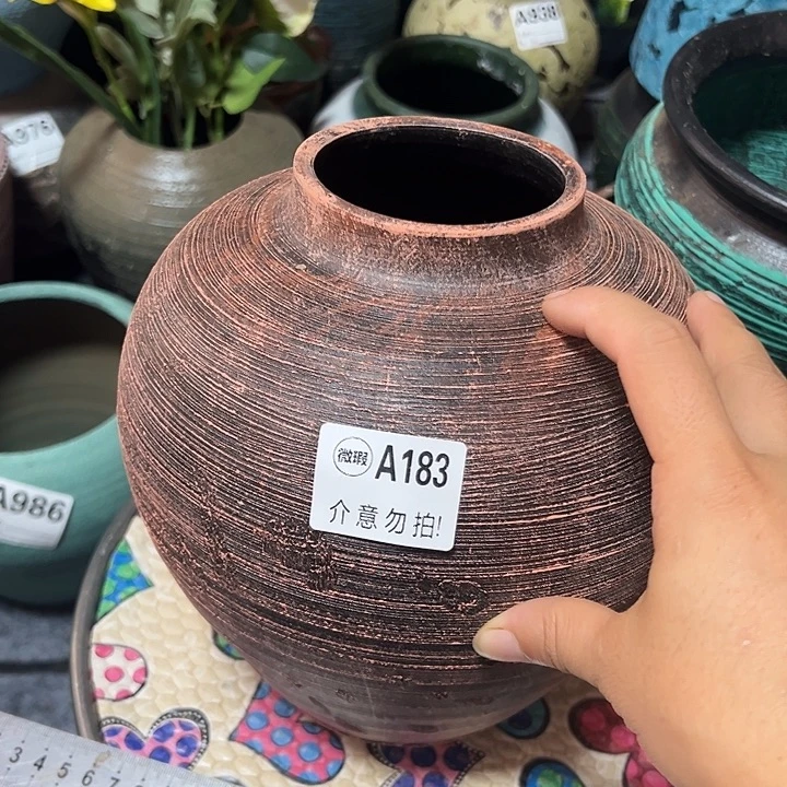 183底部窑裂有孔高20口9