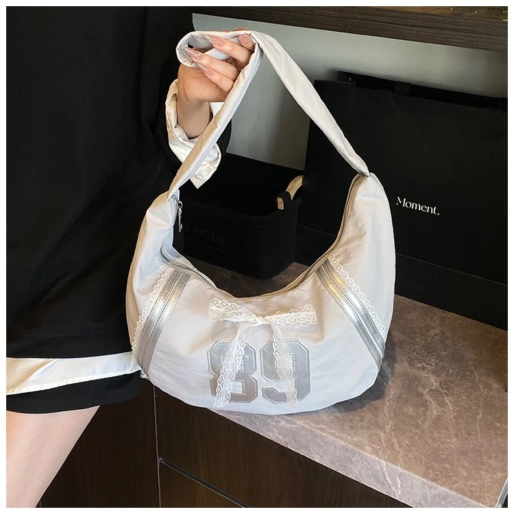 轻奢大容量高级感通勤斜挎包包女2025新款洋气粉色饺子包学生书包