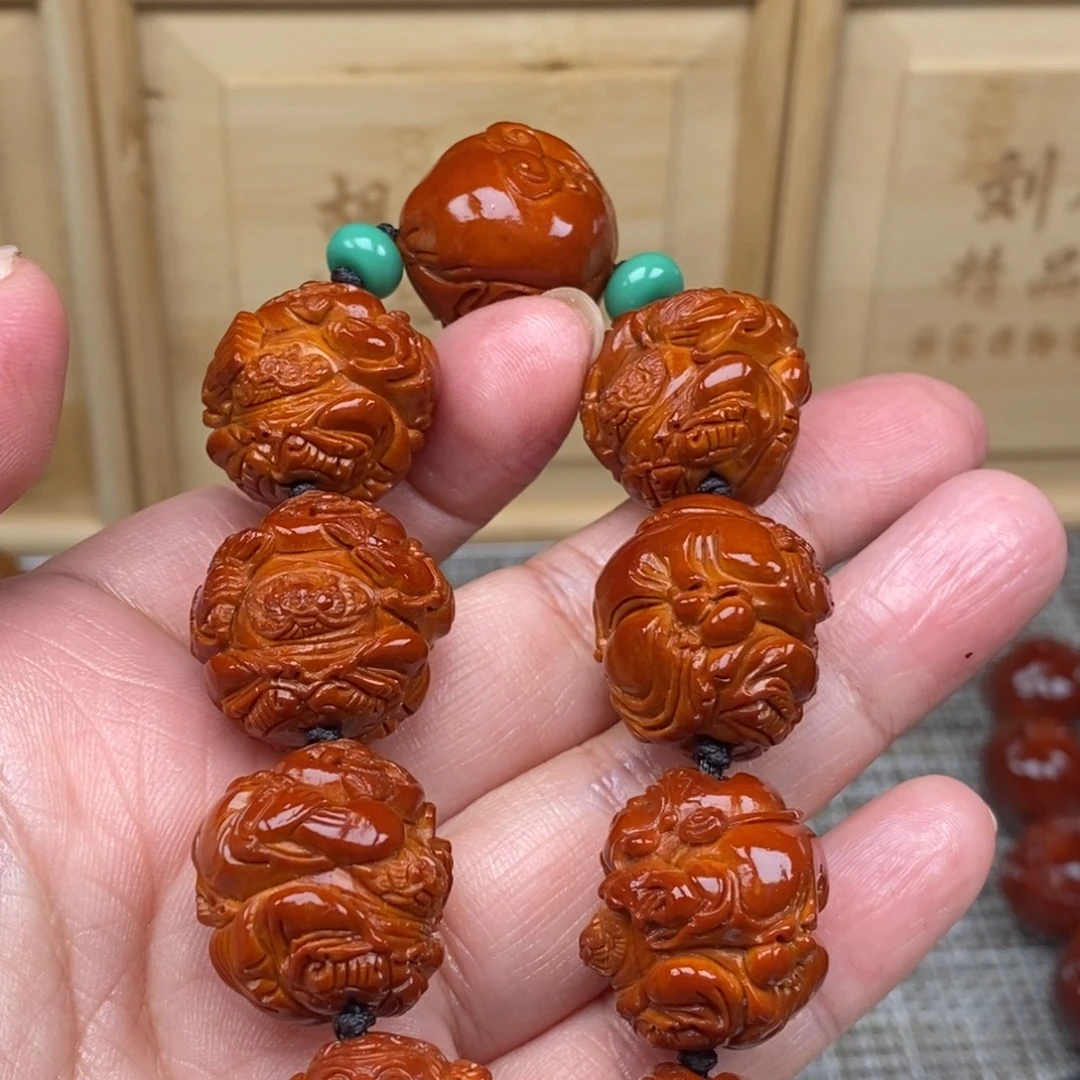 （***司橄榄核吊坠财神23