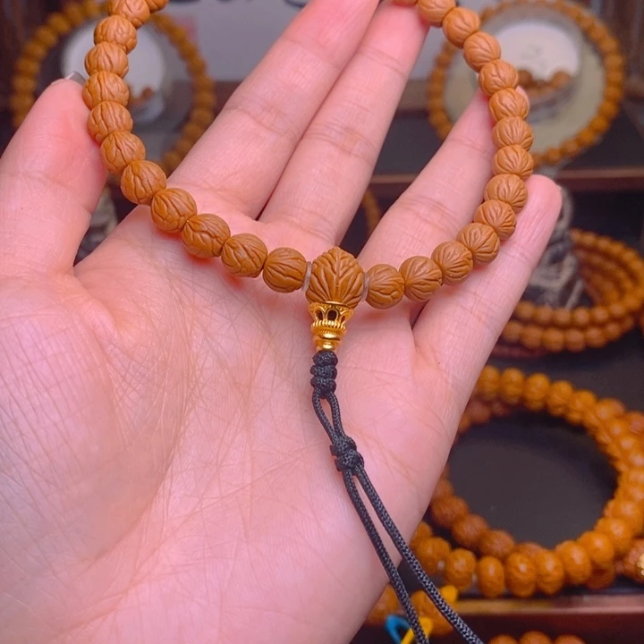 尚***)桃核手串龙泽站旁