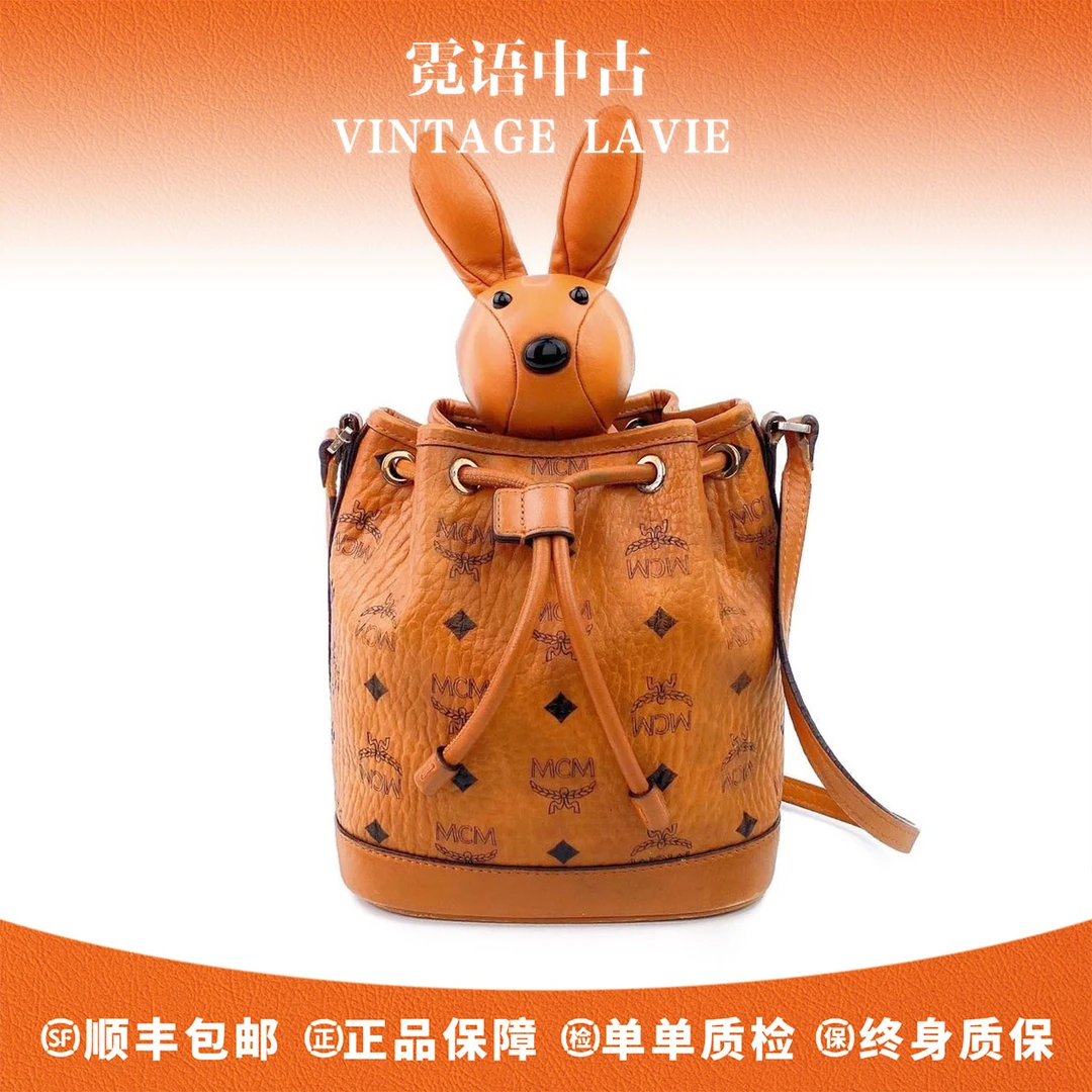 99新 MCM 老花牛皮抽绳水桶兔子包单肩包