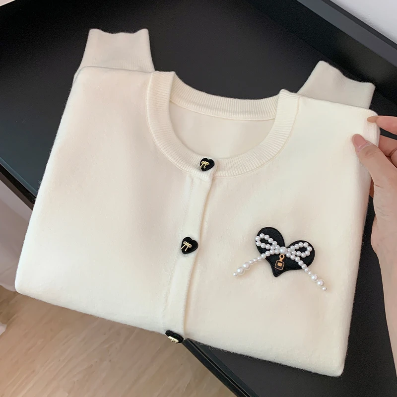 秋冬新款蝴蝶结设计感洋气时髦韩版单排扣针织开衫上衣女