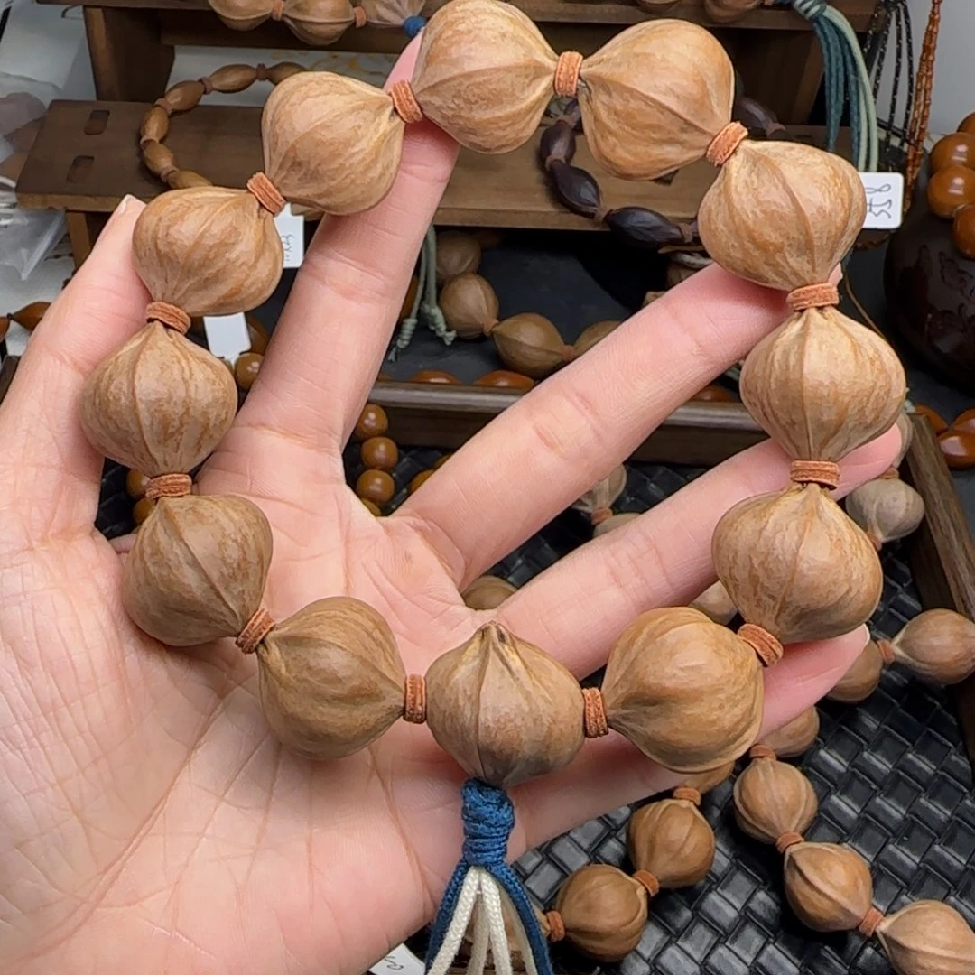 手串橄榄核01。2.35*2.4四花